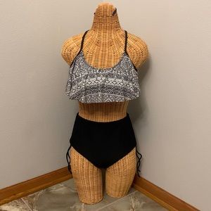 2 piece swim, black and white, top is size Large and bottoms size medium